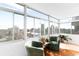 Sun-drenched sun room offering comfortable seating and panoramic city views at 1313 N Williams St # 1003, Denver, CO 80218