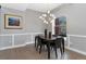 Dining room with modern lighting, stylish decor, and a picturesque view through the window at 2560 Champa St, Denver, CO 80205