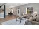 Open-concept living and dining area with stylish furnishings and ample natural light at 2560 Champa St, Denver, CO 80205