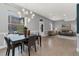 Open-concept living and dining area with stylish furnishings and ample natural light at 2560 Champa St, Denver, CO 80205