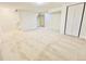 Finished basement with neutral carpet, closet, and ample space for recreation and storage at 4623 S Lowell Blvd, Denver, CO 80236