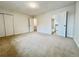 Carpeted bedroom shows closet space with an attached bathroom at 4623 S Lowell Blvd, Denver, CO 80236
