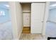 Bedroom closet with sliding door and built-in shelf and coat hooks at 4623 S Lowell Blvd, Denver, CO 80236