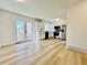 Bright kitchen features stainless steel appliances, white cabinets, and access to the patio at 4623 S Lowell Blvd, Denver, CO 80236