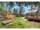 Backyard with a play structure and a deck with a seating area at 6275 Ponderosa Way, Parker, CO 80134