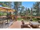 Backyard deck with outdoor furniture perfect for enjoying a sunny afternoon at 6275 Ponderosa Way, Parker, CO 80134
