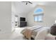 Bright bedroom features vaulted ceilings, large windows, and private balcony access at 6275 Ponderosa Way, Parker, CO 80134