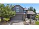 Charming two-story home featuring a stylish exterior, attached garage, and well-kept landscaping at 6275 Ponderosa Way, Parker, CO 80134