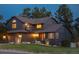 Well-maintained home exterior with a spacious two-car garage and manicured lawn at 6275 Ponderosa Way, Parker, CO 80134