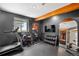 Home gym featuring modern exercise equipment and plenty of natural light at 6275 Ponderosa Way, Parker, CO 80134