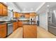 Spacious kitchen with stainless steel appliances and a central island at 6275 Ponderosa Way, Parker, CO 80134