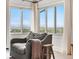 Cozy armchair with a scenic view from the large windows in this relaxing and bright room at 6275 Ponderosa Way, Parker, CO 80134