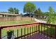 Deck with a nice view of the backyard that has a lush, green lawn and a tall fence at 6869 Quay St, Arvada, CO 80003