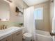 A bathroom with a vanity sink and a bathtub with shower at 6869 Quay St, Arvada, CO 80003