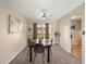 Cozy dining area with modern ceiling fan and sliding door to deck at 6869 Quay St, Arvada, CO 80003