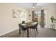 Inviting dining room with backyard access and seating for four at 6869 Quay St, Arvada, CO 80003