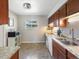 A kitchen with stainless steel appliances, granite countertops, and updated cabinetry at 6869 Quay St, Arvada, CO 80003