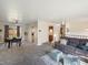Spacious living room with neutral carpet, comfortable sofa, and dining area at 6869 Quay St, Arvada, CO 80003
