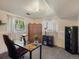 Office with gray carpet, dual windows with white curtains, modern desk, and black shelving at 6869 Quay St, Arvada, CO 80003