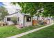 Exterior shot of a well-maintained property, showcasing its landscaped yard and charming outdoor patio at 8314 S Everett Way # B, Littleton, CO 80128