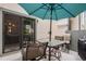 Outdoor patio area with seating, a grill, and an umbrella for comfortable outdoor living at 8314 S Everett Way # B, Littleton, CO 80128