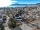 Aerial view of the charming home, featuring mature trees and mountain views in the background at 1620 Oak Ave, Boulder, CO 80304