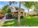 An inviting backyard features a stone patio and a lush green lawn perfect for outdoor entertaining at 1620 Oak Ave, Boulder, CO 80304