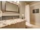 Well-lit bathroom featuring a granite countertop, undermount sink, and shower with tub at 1620 Oak Ave, Boulder, CO 80304