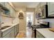 Charming kitchen with light cabinets and stainless steel appliances at 1620 Oak Ave, Boulder, CO 80304