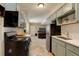 Charming kitchen featuring gray cabinets, stainless steel appliances, and a double basin sink at 1620 Oak Ave, Boulder, CO 80304