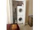 This laundry closet features a stacked washer and dryer for space-saving convenience at 1620 Oak Ave, Boulder, CO 80304