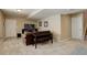 Spacious living room features neutral carpet, a brown sofa, entertainment center, and backyard access at 1620 Oak Ave, Boulder, CO 80304