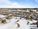 Community overview showing homes and a snow-covered golf course at 8171 S Catawba Ct, Aurora, CO 80016