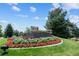 Attractive entrance to Heritage at Castle Pines community with landscaping at 8171 S Catawba Ct, Aurora, CO 80016