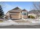 Beautiful ranch home with 2-car garage, landscaped yard, and snow-covered front at 8171 S Catawba Ct, Aurora, CO 80016