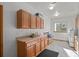 Laundry room with built-in cabinets and a window at 8171 S Catawba Ct, Aurora, CO 80016