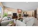 Spacious living room with comfortable seating and a fireplace at 8171 S Catawba Ct, Aurora, CO 80016