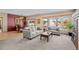 Spacious living room with fireplace and view of golf course at 8171 S Catawba Ct, Aurora, CO 80016