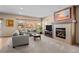 Living room with fireplace and view of backyard at 8171 S Catawba Ct, Aurora, CO 80016