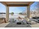Covered patio with seating area and golf course view at 8171 S Catawba Ct, Aurora, CO 80016