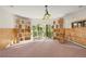 Spacious basement with wood paneled walls, modern lighting, and sliding glass doors to the outside at 28890 Pinewood Vista Dr, Evergreen, CO 80439