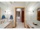 Bright bathroom features a shower and sink with vanity, offering style and function at 28890 Pinewood Vista Dr, Evergreen, CO 80439