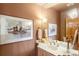 Cozy bathroom featuring warm earth tones and elegant fixtures at 28890 Pinewood Vista Dr, Evergreen, CO 80439