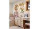 Bright bathroom featuring a vanity with decorative mirror and natural light from window at 28890 Pinewood Vista Dr, Evergreen, CO 80439