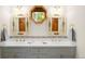 Charming bathroom with decorative mirrors, stylish tilework, and ample counter space at 28890 Pinewood Vista Dr, Evergreen, CO 80439