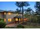 Stunning home featuring a large deck, nestled among mature trees, offering breathtaking views at 28890 Pinewood Vista Dr, Evergreen, CO 80439
