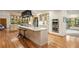 Charming kitchen with ample counter space, stainless appliances, and center island with seating at 28890 Pinewood Vista Dr, Evergreen, CO 80439