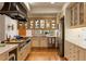 Bright kitchen features custom cabinetry, stainless steel appliances, and plenty of natural light at 28890 Pinewood Vista Dr, Evergreen, CO 80439