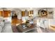 Open-concept living space with wood beams, seamless access to the dining area, and ample natural light at 28890 Pinewood Vista Dr, Evergreen, CO 80439