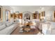 Spacious living room offers a seamless flow with natural wood accents and seamless views into the dining area at 28890 Pinewood Vista Dr, Evergreen, CO 80439